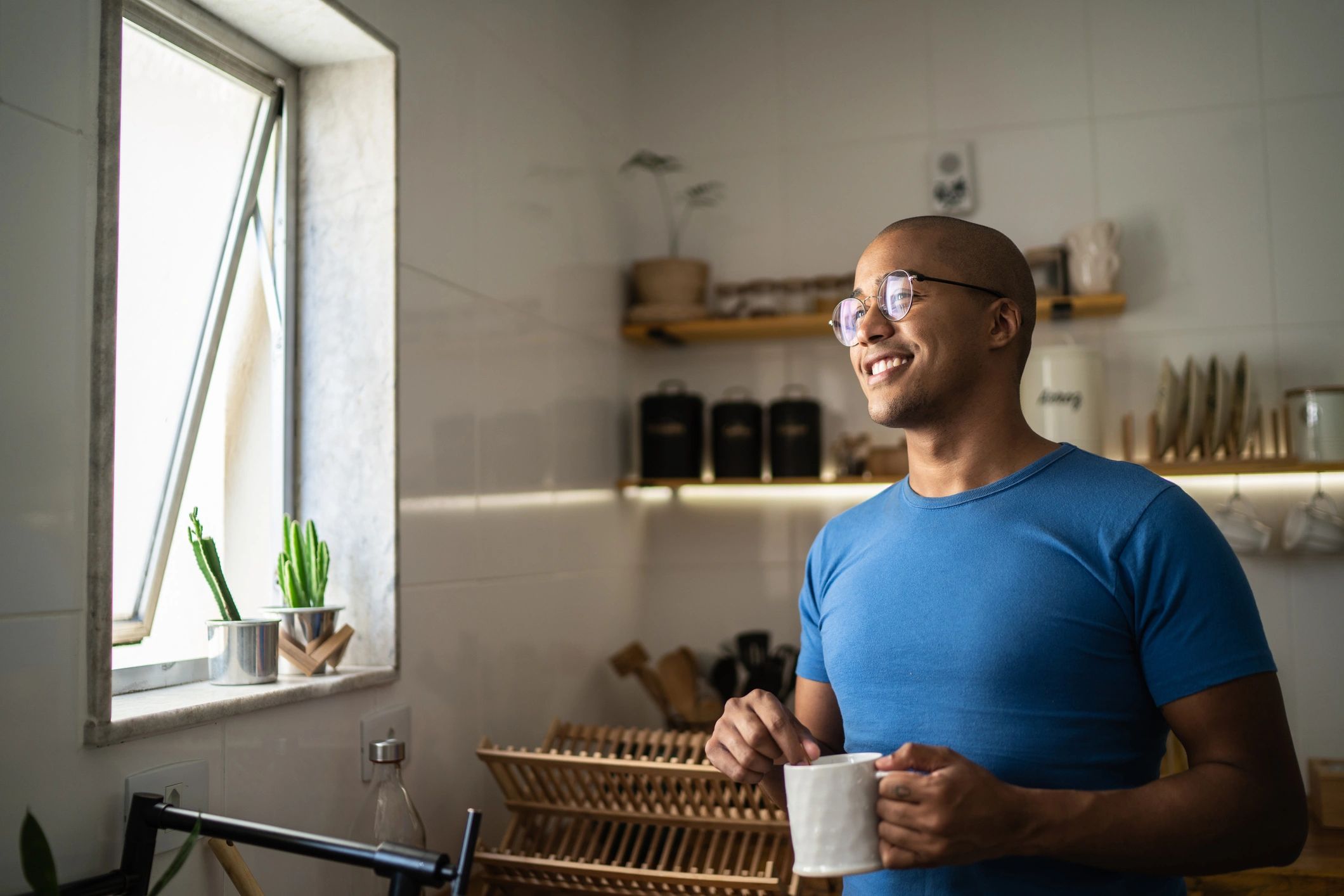 Young man drinking coffee or tea at home