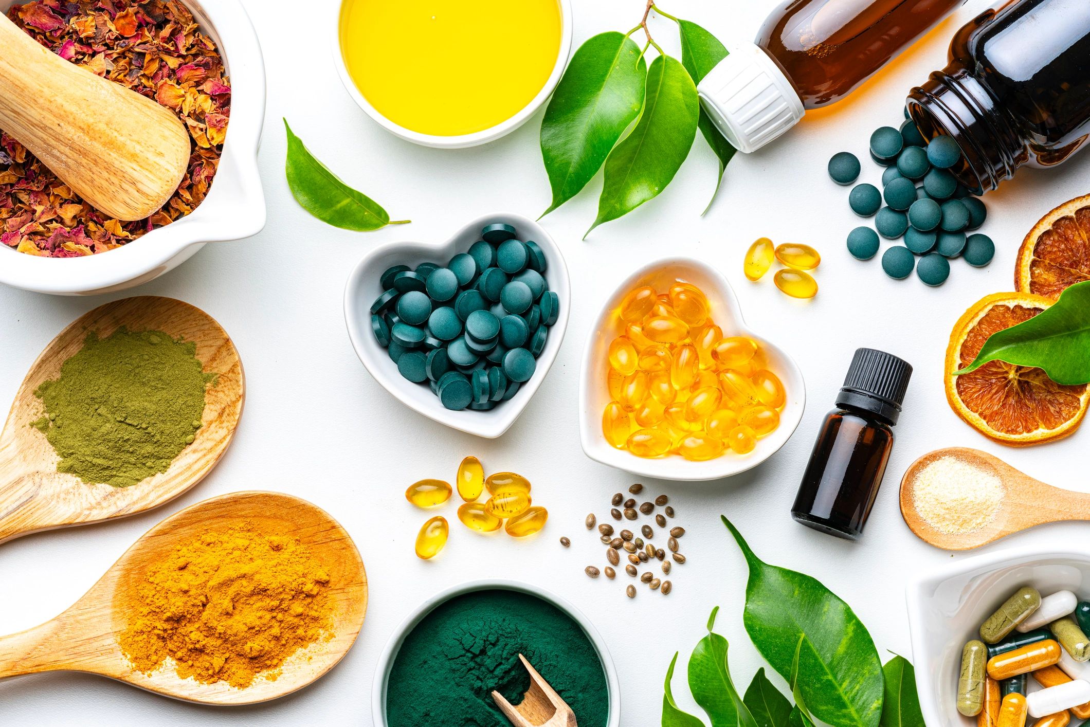 Supplements and vitamins arranged on a white background